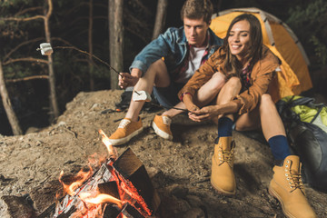 couple roasting marshmallow