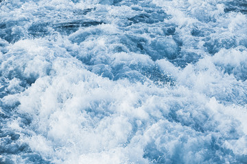 Stormy sea water with splashes and foam