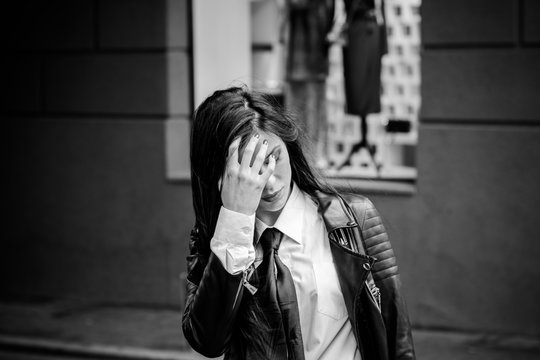 Young girl is depressed thoughts about suicide problems in her personal life, negative emotions . Problems of adolescents in social life. woman in solitude, in bad mood, sorrow and alone