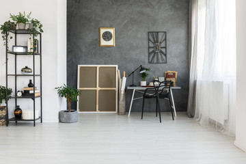 Simple workspace on gray wall