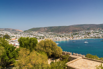 Fototapeta na wymiar Sunny view of harbour from Castle of St. Peter, Bodrum, Mugla province, Turkey.