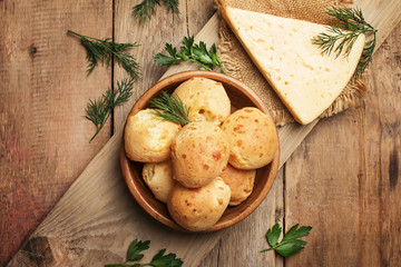Homemade cheese buns, rustic style, vintage wooden background, top view