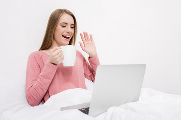 woman making video call on laptop