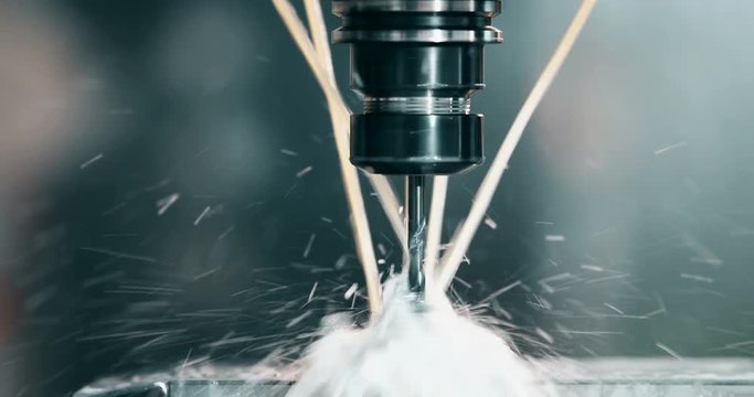 industrial worker working with cnc milling machine