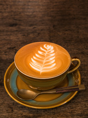 hot coffee cup on old wood table background