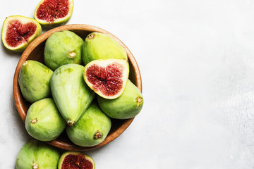 Sweet green figs, gray background, top view