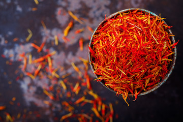 Dried saffron spice a glass of metal Oriental flavor. Raw Organic pistil powder saffron Red Exotic...