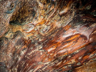 Teak wood is the background.