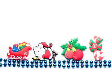 beads on a white background with christmas toys