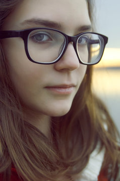 Portrait of young girl with glasses,close up