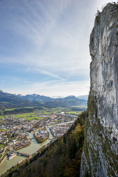 A mountain climber is hanging on the wall of the one of the Barmsteine rock towers, which are part of the Hassel Mountains in the Bavarian Alps between Austria and Germany.