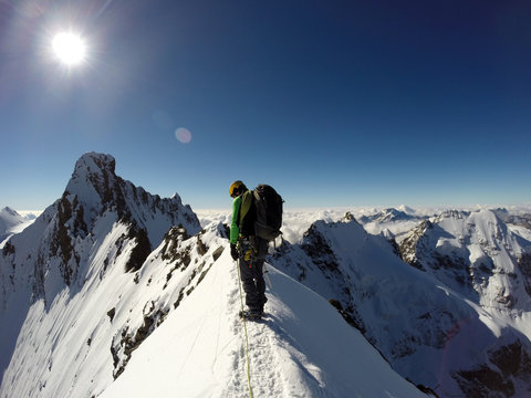 Man climbing at Piz Bernina peak
