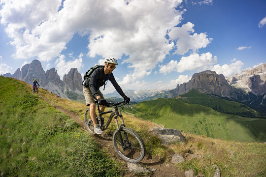 Mountain bikers in the Val Gardena valley in the Dolomite Mountains in Northeastern Italy.