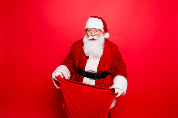 Omg! Increadible unbelievable crazy december surprise time! Holly jolly x mas noel! Closeup of aged excited astonished santa with wide open eyes, mouth, having a sack in arms