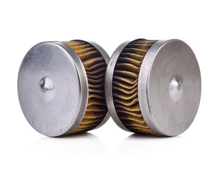 Old automotive oil filter cartridge isolated on a white background.