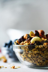 Homemade granola with milk, fresh berries, milk for breakfast. Copy space. Healthy breakfast concept