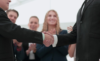 Handshake between competitors before the start of business negot