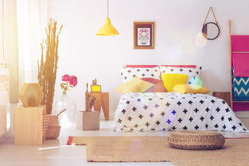 Pouf in folk bedroom interior
