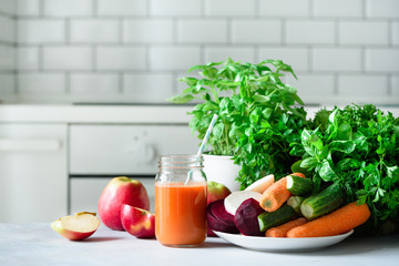 Fresh juice or smoothie, fruits and vegetable - apples, carrot, beet, celery, cucumber, greens, herbs. Vegetarian, raw food concept, clean eating, detox