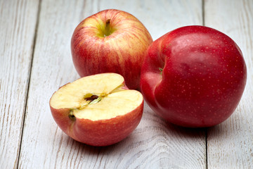 red apples on old wooden background