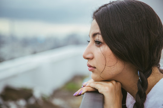Beautiful woman looking at the city view