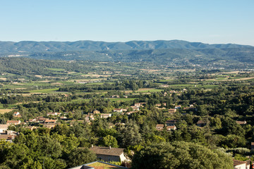 Panoramic view of cultivated fields, vineyards and mountains in Provence, France