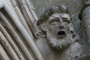 Horrific gargoyle on a historic cathedral in England