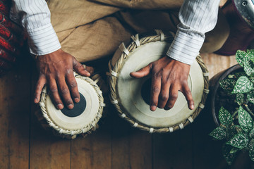 Indian man playing traditional indian drums