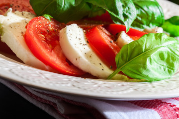 Caprese salad with mozzarella, tomato, basil