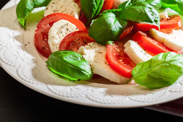 Caprese salad with mozzarella, tomato, basil