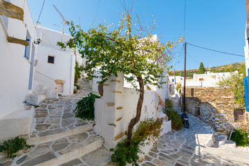 Street, intersection in Lefkes, Paros, Greece on a sunny summer day, horizontal