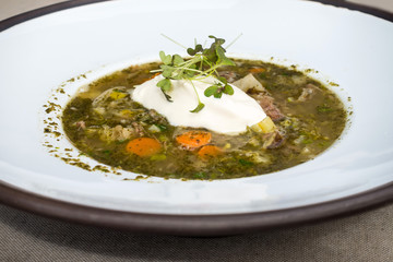 Fine dining cuisine - french dish soup on the table