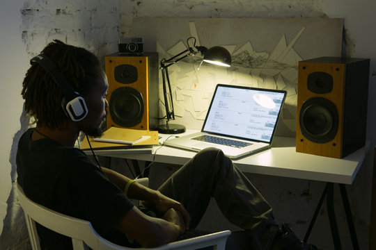 African Man Listening to Music