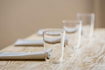 glasses and serviettes on the table