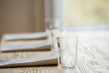 glasses and serviettes on the table