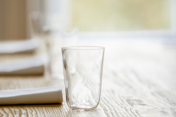 glasses and serviettes on the table
