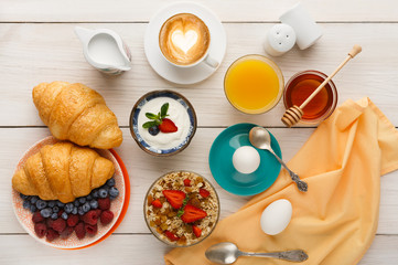 Continental breakfast menu on woden table