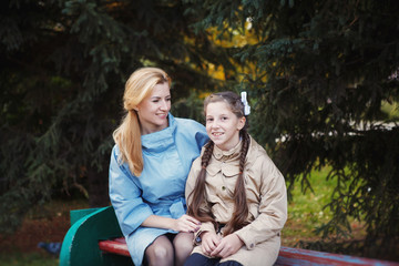 Fototapeta premium Mom with her daughter during autumn