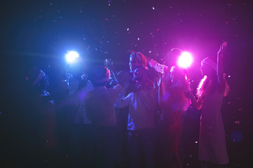 Obraz na płótnie Canvas Group of friends at christmas party at night club