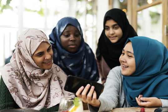 Group of students using mobile phone