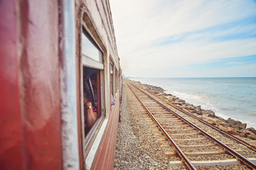 train rides along the the ocean shore