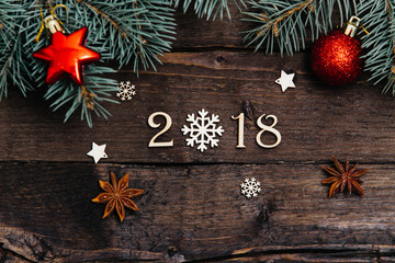 Sigh symbol from number 2018 on vintage style wooden texture background. Happy New Year 2018 greetings on wooden. snowflake wood. Empty space for your text. instead of zero snowflake