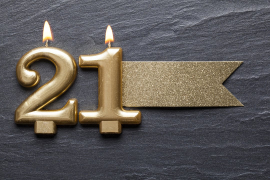 Gold number 21 celebration candle with glitter label