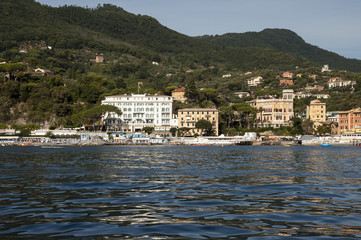 Santa Margherita Ligure, Liguria Italia -  watching the coast from the sea. the Village with the typical architecture of the houses just behind the beaches. Miramare Hotel.