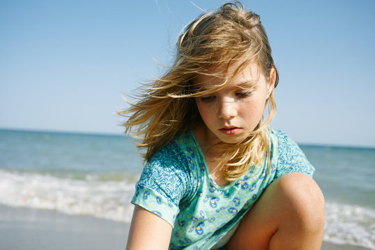 Close up of little girl playing at the beach