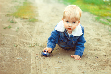 a boy plays in the sand