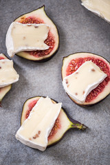 Camembert and fresh figs on stone slate