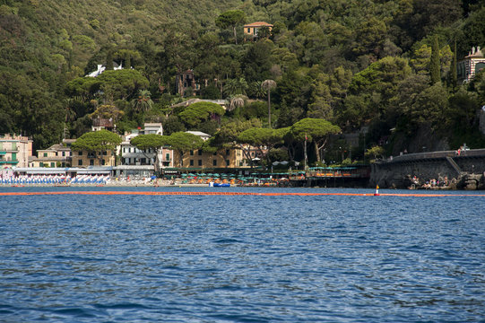 Portofino, Liguria Italia - watching the coast from the sea. View of the beaches of Paraggi near Portofino with crystalline waters