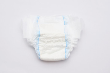 Disposable Baby Diapers Over White Background - obrazy, fototapety, plakaty