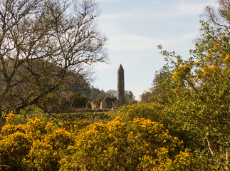 The ancient round tower in the cemetery at the historic Glendalough Monastic Site in County Wicklow...